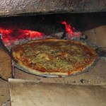The First Pizza in the new oven--A learning experience with the fire.