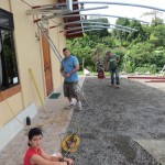 The carport under construction: Luiscito in the foreground supervising