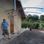 The carport under construction with Betto, the builder--he bent the arc using his  weight!!!